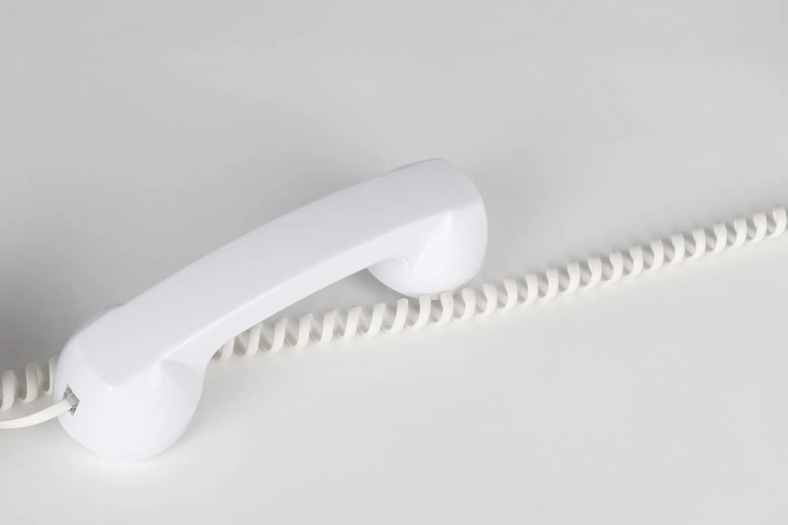 Empty clinic reception desk with a phone ringing unanswered